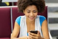 African student girl with smartphone on lecture Royalty Free Stock Photo