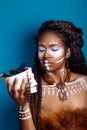 African style . Attractive young woman in ethnic jewelry . close up portrait of a woman with a painted face. Creative make up Royalty Free Stock Photo