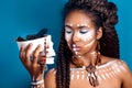 African style . Attractive young woman in ethnic jewelry . close up portrait of a woman with a painted face. Creative make up Royalty Free Stock Photo