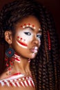 African style . Attractive young woman in ethnic jewelry . close up portrait of a woman with a painted face. Creative make up Royalty Free Stock Photo