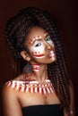 African style woman . Attractive young woman in ethnic jewelry. close up portrait. Portrait of a woman with a painted face. Royalty Free Stock Photo