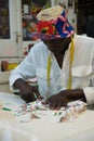 An african tailor cutting fabric in his sewing shop. Royalty Free Stock Photo