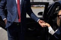 African taxi driver opening the door of car