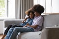 African teenage couple in love resting on sofa enjoy talk Royalty Free Stock Photo