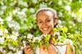 African teenager girl holds white pear flowers Royalty Free Stock Photo
