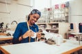 African textile worker sewing on production line