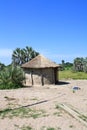 African Thatched Hut with Solar Panel in Northern Botswana