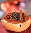 African thumb piano against colorful abstract background