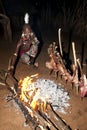 African tribal man of the Hamer ethnic roast Goat