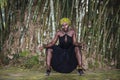 African tribal woman sitting in the jungle Royalty Free Stock Photo