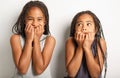 african twin little girls on studio gray background with afraid portrait Royalty Free Stock Photo