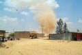 African village and sand tornado. Kenya, Africa