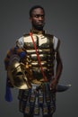 African warrior from ancient greece against grey background