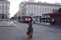 African woman at the Atac bus terminal in Rome, Italy