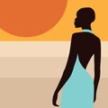 African woman on the background of the setting sun in the desert. A beautiful young woman in a blue dress.