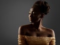 African Woman Black Silhouette. Dark Skin Beauty Model with Golden Make up Profile Side View over Gray. Fashion Girl Face Portrait Royalty Free Stock Photo