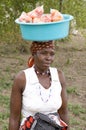 African woman with bowl on head