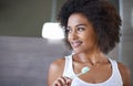 African woman, brushing teeth and happy in bathroom for oral wellness, health and benefits for mouth in home. Girl Royalty Free Stock Photo