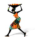 African woman carrying a basket of fruit Royalty Free Stock Photo