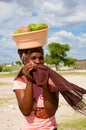 African woman carrying fruits on her head in Botswana