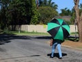 African woman with colorful umbrella