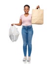 african woman comparing paper and plastic bags