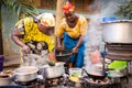 African woman cooking traditional food on street Royalty Free Stock Photo