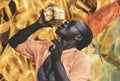 African woman cools off in the heat with a coconut