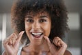 African woman, dental floss and happy in portrait for oral wellness, health and benefits for mouth in bathroom. Girl Royalty Free Stock Photo