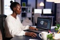 African woman engineer working at new project doing overtime Royalty Free Stock Photo