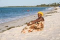 African woman enjoying the beach.