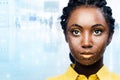 African woman with facial recognition scan on face.