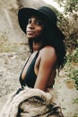 African woman, fashion and closeup with nature, portrait and beach for adventure. Tourist, clothes and holiday for