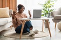 African Woman Having Video Call Conversation Via Laptop At Home Royalty Free Stock Photo