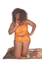 African woman kneeling in bikini . Royalty Free Stock Photo