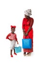 African woman with little girl in traditional clothing with tote bags.Isolated Royalty Free Stock Photo