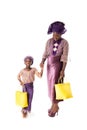 African woman and little girl in traditional clothing with tote bags.Isolated Royalty Free Stock Photo