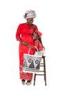 African woman and little girl in traditional clothing with tote Royalty Free Stock Photo