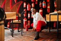 African woman posed against wall with old extinguisher. Royalty Free Stock Photo