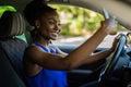 African woman posing for selfie inside her car Royalty Free Stock Photo