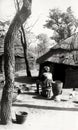 An African woman preparing food in a rural village near Damongo in Ghana, c.1959 Royalty Free Stock Photo