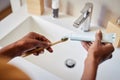 African woman put tooth paste on ecological toothbrush Royalty Free Stock Photo