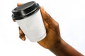 African Woman`s hands holding white paper coffee cup or another hot drink in the cold season on white. Creative Mockup of Royalty Free Stock Photo