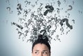 African woman`s head and floating question marks Royalty Free Stock Photo