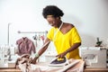 African Woman seamstress Ironing cloth