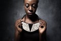 African woman shows a ceramic ethnic necklace Royalty Free Stock Photo