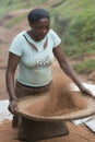 African woman sift chaff of the millet Royalty Free Stock Photo