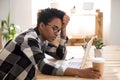 African woman sitting at the desk at office and sleeping Royalty Free Stock Photo