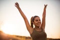 Woman standing in the nature and outstretched arms Royalty Free Stock Photo