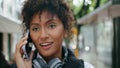 African woman talking phone walking on city street close up. Girl finish call Royalty Free Stock Photo